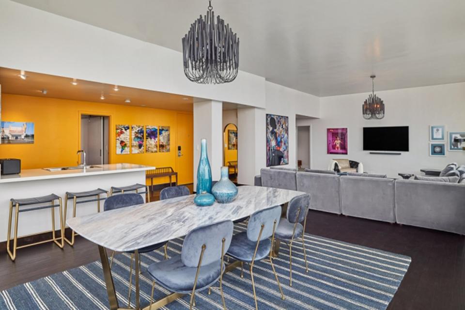 The living and dining room in the Panoramic Suite at Andaz West Hollywood Suite