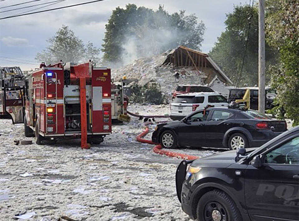 Emergency vehicles are at the scene of a deadly propane explosion, Monday, Sept. 16, 2019, which leveled new construction in Farmington, Maine. (Jacob Gage via AP)