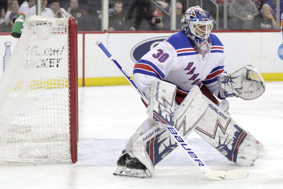 FILE - In this April 1, 2019, file photo, New York Rangers goaltender Henrik Lundqvist, of Sweden, is shown in action against the New Jersey Devils during the second period of an NHL hockey game, in Newark, N.J. “The King” is 37 yet could be the difference between the New York Rangers missing the playoffs for a third consecutive season and contending ahead of schedule. (AP Photo/Julio Cortez, File)