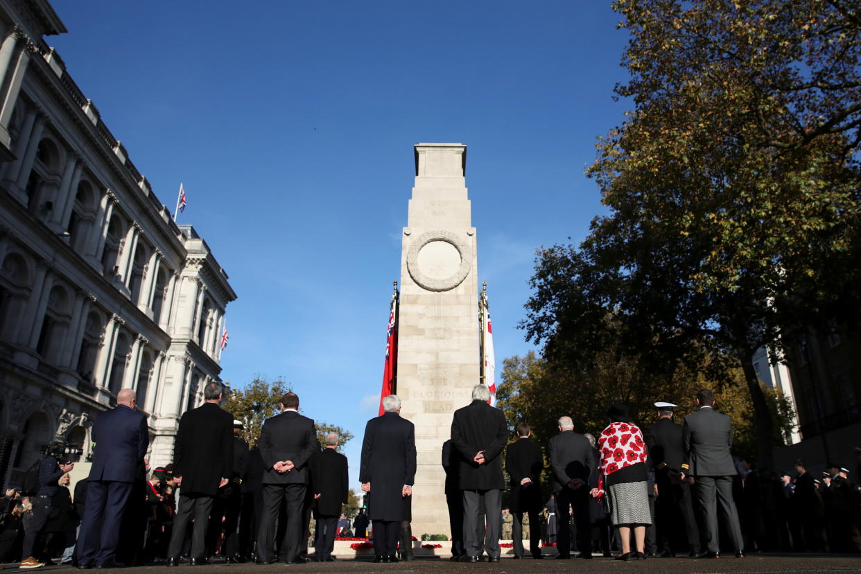 People pause to observe a two-minute silence at the Cenotaph, Whitehall, as part of remembrance commemorations in London, Britain, November 11, 2021. REUTERS/Peter Cziborra