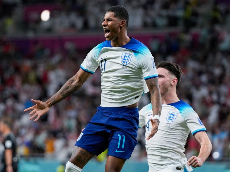 Rashford celebrates after scoring the opening goal (AP)