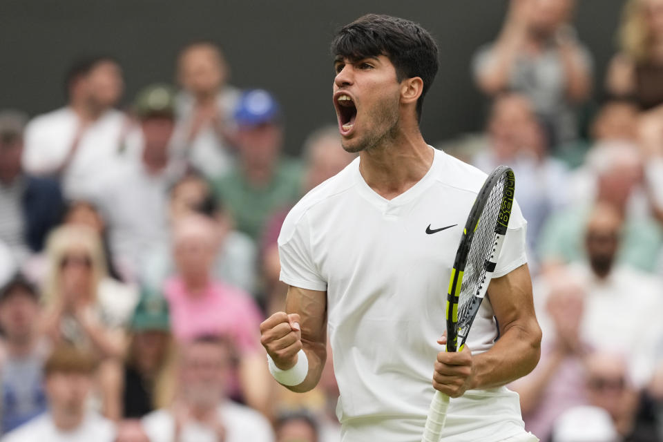 Spain's Carlos Alcaraz reacts after winning a point against Francis Tiafoe of the United States during their third round match at the Wimbledon tennis championships in London, Friday, July 5, 2024. (AP Photo/Alberto Pezzali)