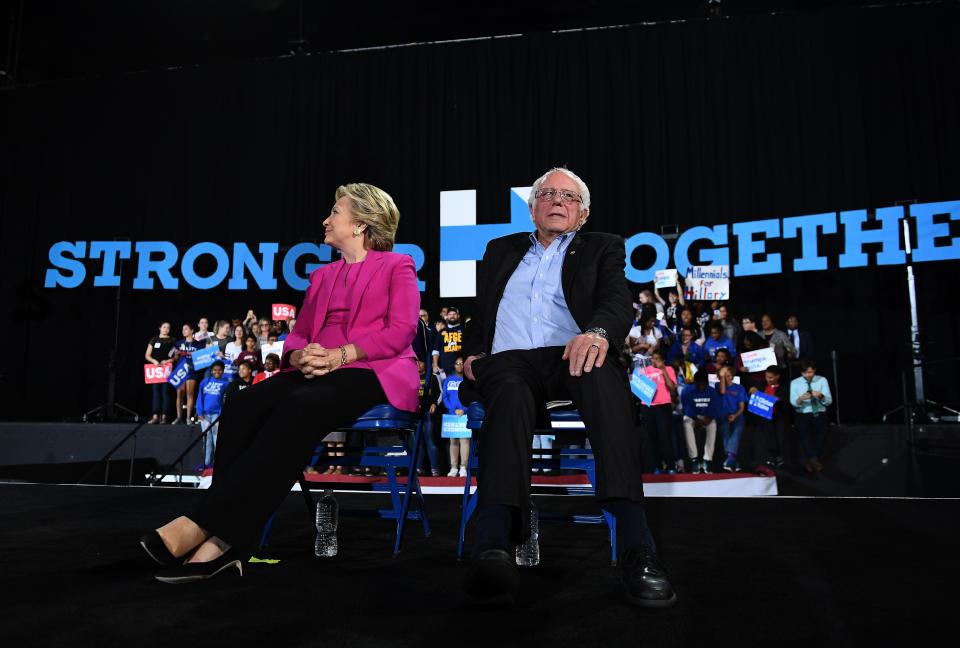 US Democratic presidential nominee Hillary Clinton and Bernie Sanders listen to singer Pharrell Williams during a campaign rally in Raleigh, North Carolina, on November 3, 2016. (Photo: Jewel Samad/AFP via Getty Images)