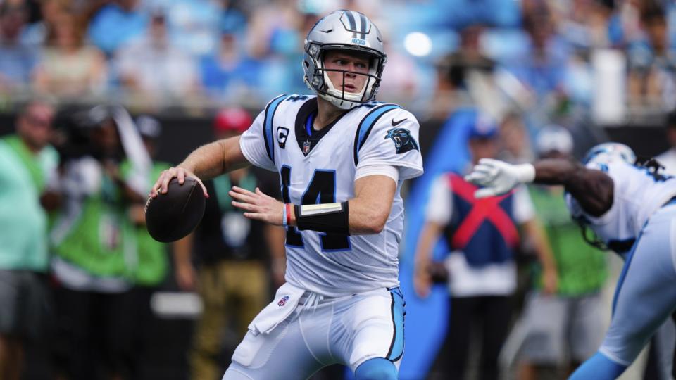 Carolina Panthers quarterback Sam Darnold passes the ball.