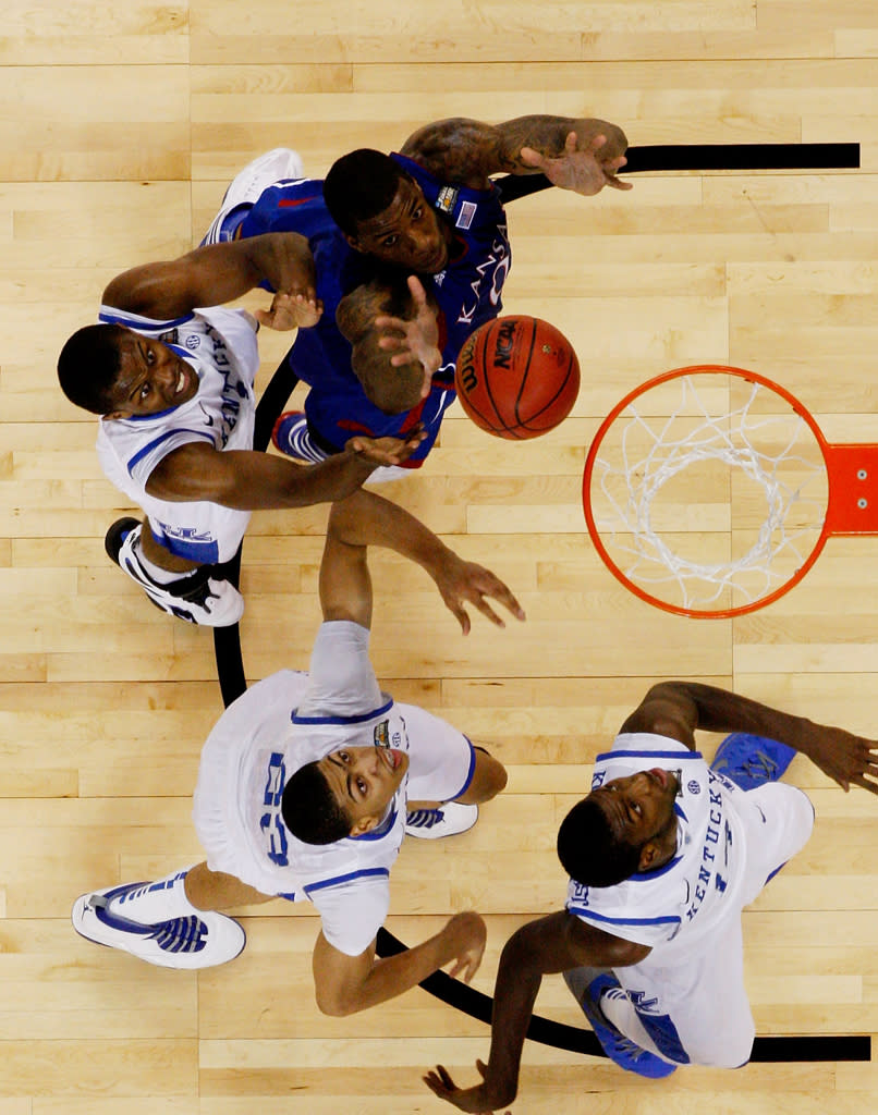 Thomas Robinson #0 of the Kansas Jayhawks goes up for a shot against Darius Miller #1 of the Kentucky Wildcats in the first half in the National Championship Game of the 2012 NCAA Division I Men's Basketball Tournament at the Mercedes-Benz Superdome on April 2, 2012 in New Orleans, Louisiana. (Photo by Chris Graythen/Getty Images)