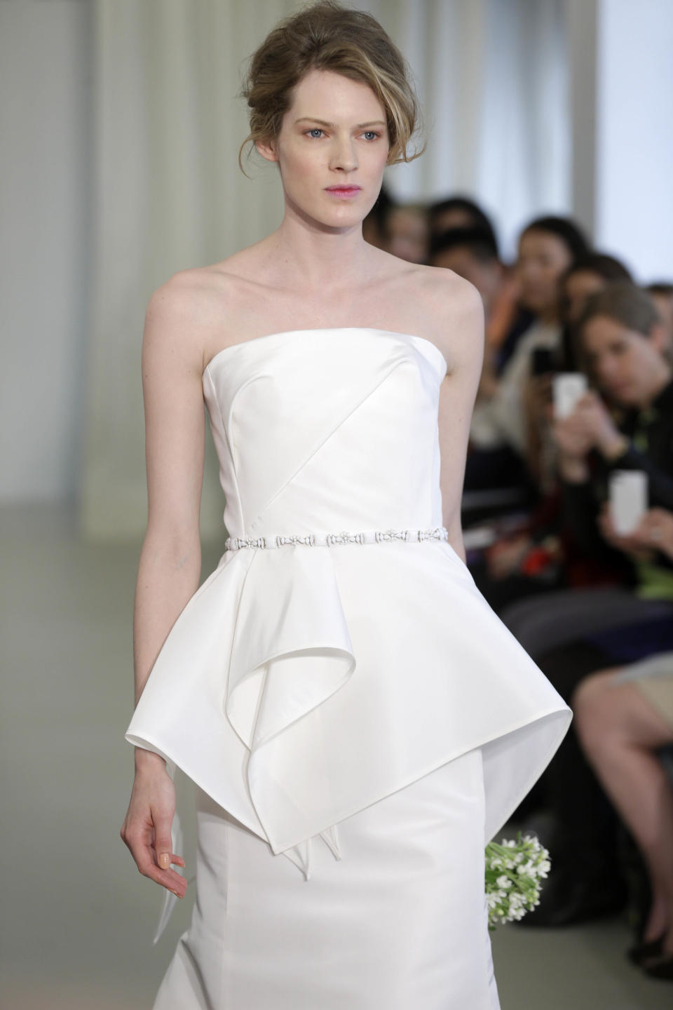 A bridal collection by Angel Sanchez is modeled in New York, Monday, April 22, 2013. (AP Photo/Seth Wenig)