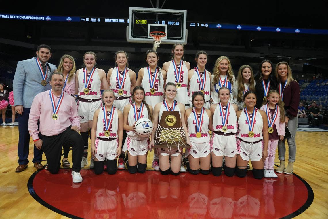 The Ben Wheeler Martin’s Mill girls basketball team poses after winning the Class 2A state championship game on Saturday, March 3, 2024 at the Alamodome in San Antonio, Texas. Martin’s Mill defeated Nocona 44-42.