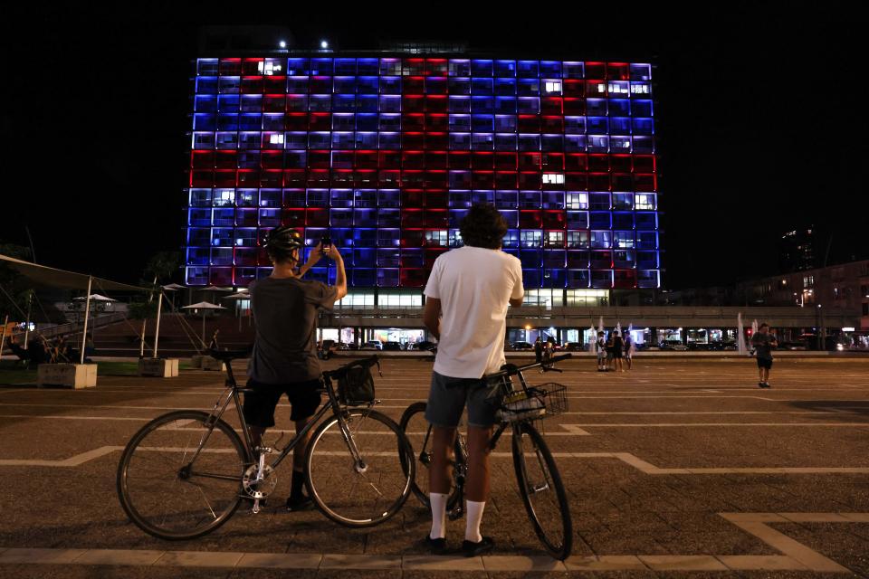 The Tel Aviv Municipality building is illuminated with the colors of the United Kingdom flag as a sign of solidarity to the British royal family following the passing of Queen Elizabeth II on September 8, 2022.