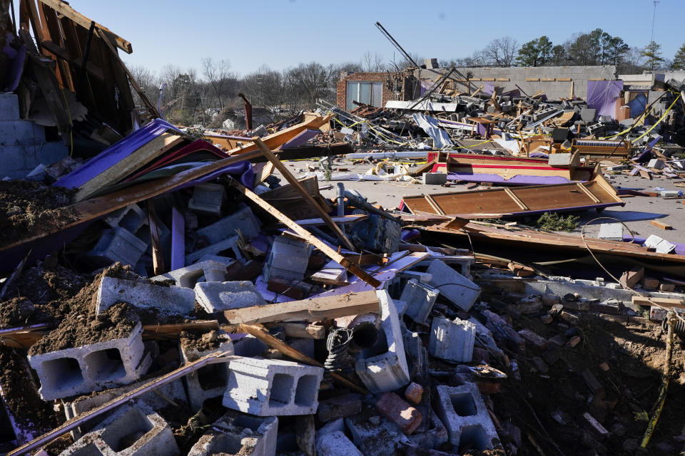 The demolished sanctuary of Community Baptist Church is seen Monday, Dec. 11, 2023 in Nashville, Tenn. Central Tennessee residents and emergency workers are continuing the cleanup from severe storms and tornadoes that hit the area. (AP Photo/George Walker IV)