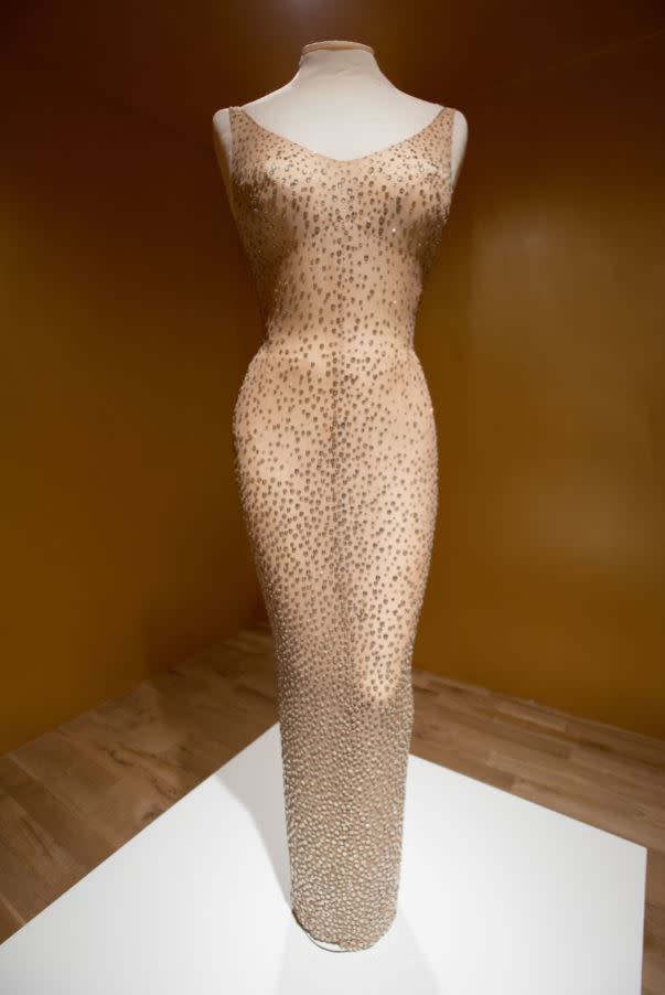 The iconic gown features more than 2,500 hand-stitched crystals (REX) 