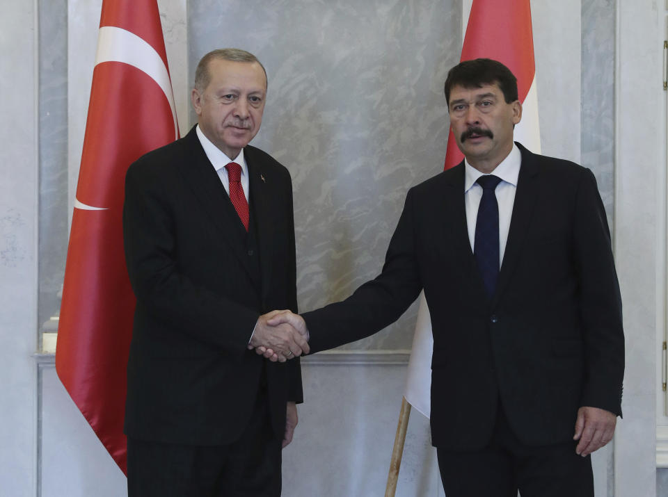 Hungarian President Janos Ader, right, and Turkish President Recep Tayyip Erdogan shake hands before a meeting, in Budapest, Hungary, Thursday, Nov. 7, 2019. Erdogan is on a one-day state visit to Hungary .( Presidential Press Service via AP, Pool )