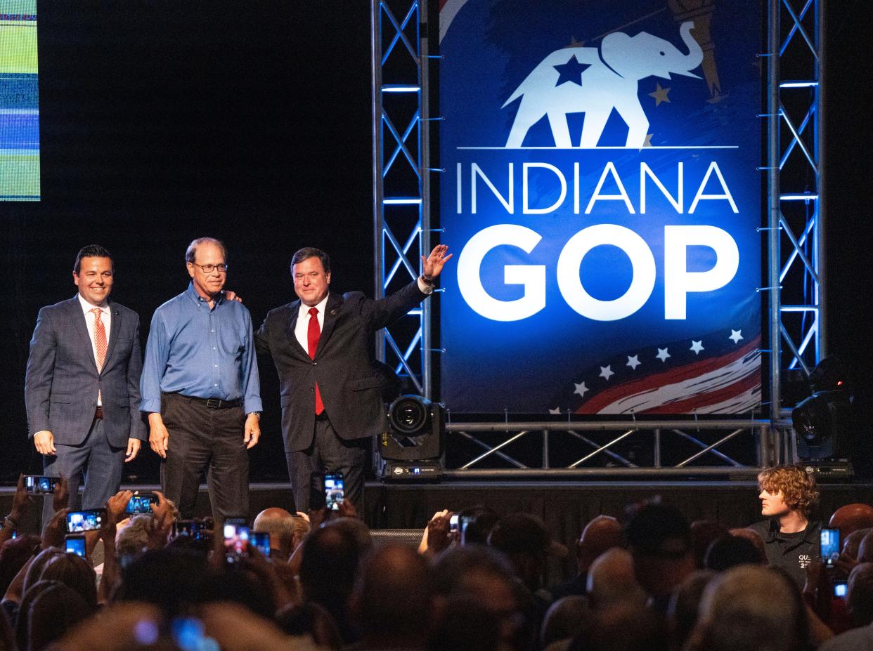 From left, the Republican nominee for lieutenant governor, Micah Beckwith, for governor, Sen. Mike Braun, and for attorney general, Todd Rokita, wave to the crowd before exiting the stage after their nominations were confirmed on Saturday, June 15, 2024, during the 2024 Indiana GOP State Convention in Indianapolis, Ind.