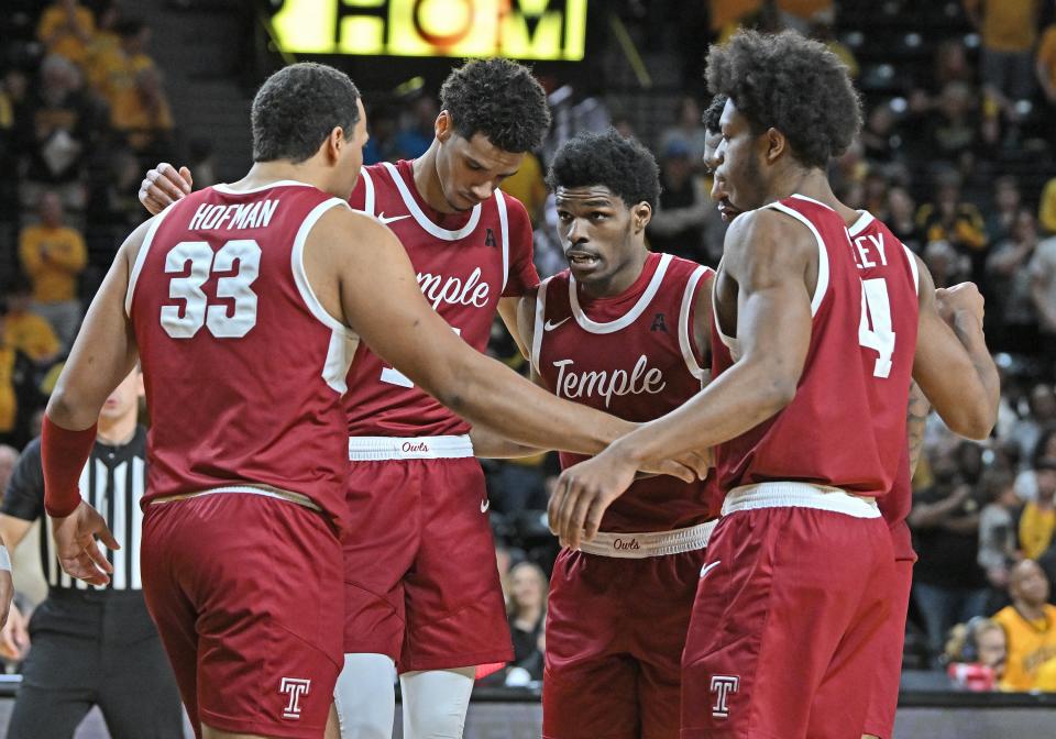 Temple players huddle during a game last month. (Peter G. Aiken/Getty Images)