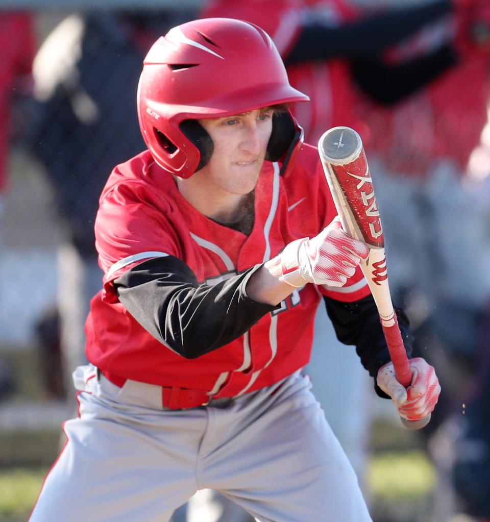 Crestwood's Kyle Shelhamer looks to bunt against Waterloo during their baseball game at Waterloo High School in Atwater on Friday, March 29, 2024.