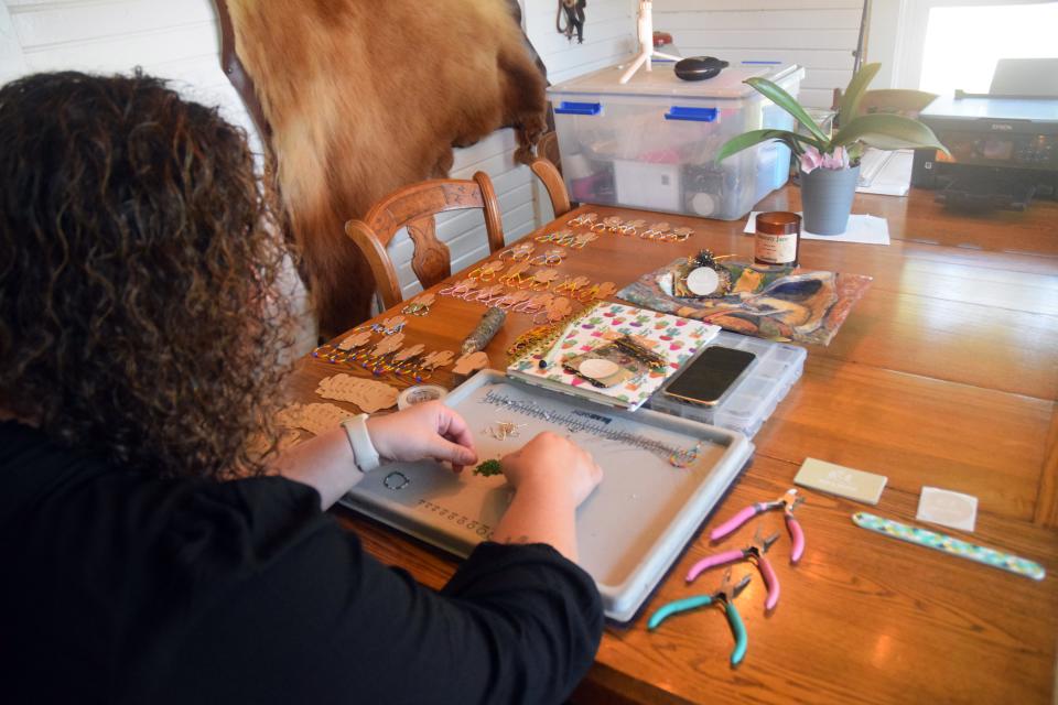 Alia Wright, owner of Bea's Beads, creates jewelry at her home in Hamburg Township on Wednesday, Sept. 20.