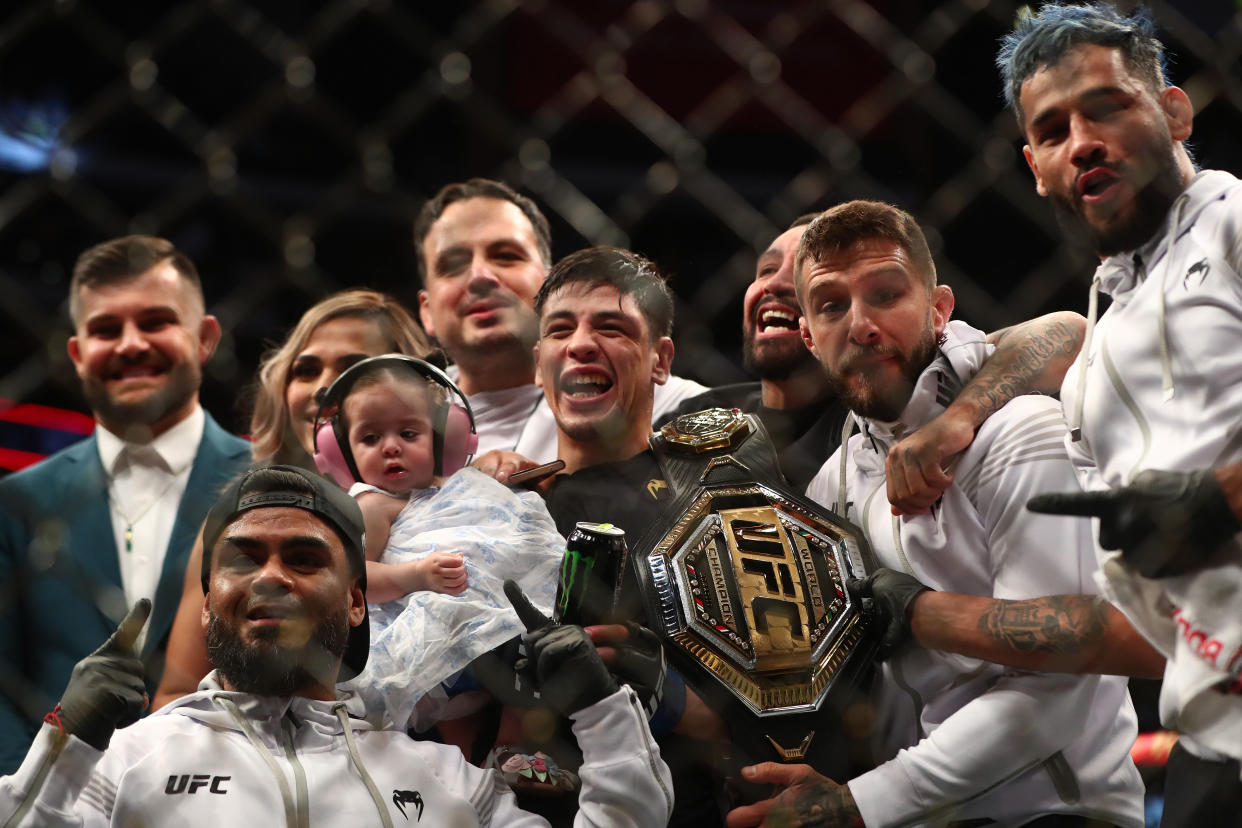 Jun 12, 2021; Glendale, Arizona, USA; Brandon Moreno poses for photos following his championship victory against Deiveson Figueiredo during UFC 263 at Gila River Arena. Mandatory Credit: Mark J. Rebilas-USA TODAY Sports