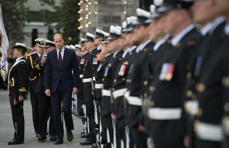 Prince William inspects the honour guard as he arrives at the Legislative Assembly in Victoria, British Columbia, Canada