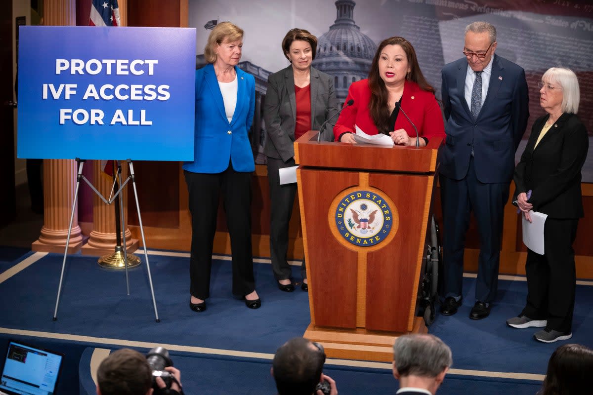 Sen. Tammy Duckworth, D-Ill., center, speaks about a bill to establish federal protections for IVF (AP)