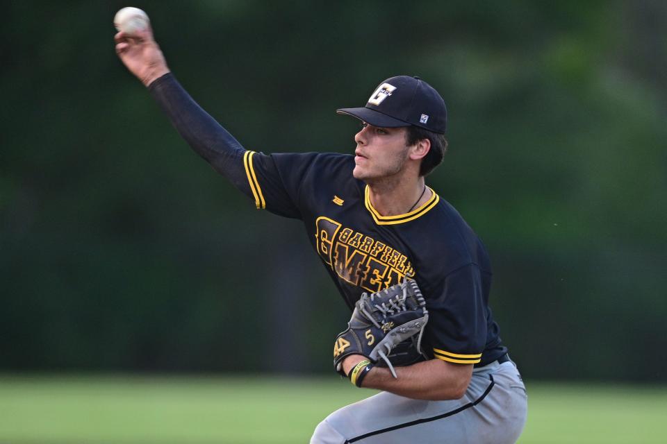 Garfield starting pitcher Eric Geddes delivers against Kirtland during the fifth inning in an OHSAA district semifinal Monday night at Cene Park in Struthers.