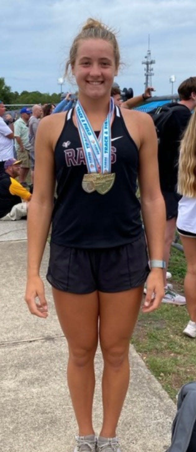Riverview's Susan Lowther wearing her first-place medals for girls discus and shot put at the Class 4A Track & Field State Championships in Jacksonville.
