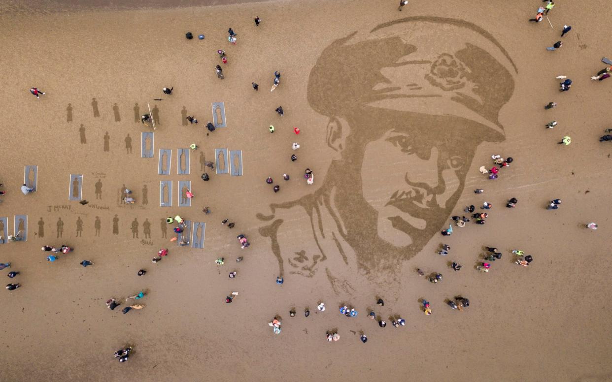 A sand drawing on Ayr Beach of Second Lieutenant Walter Tull - SWNS.com