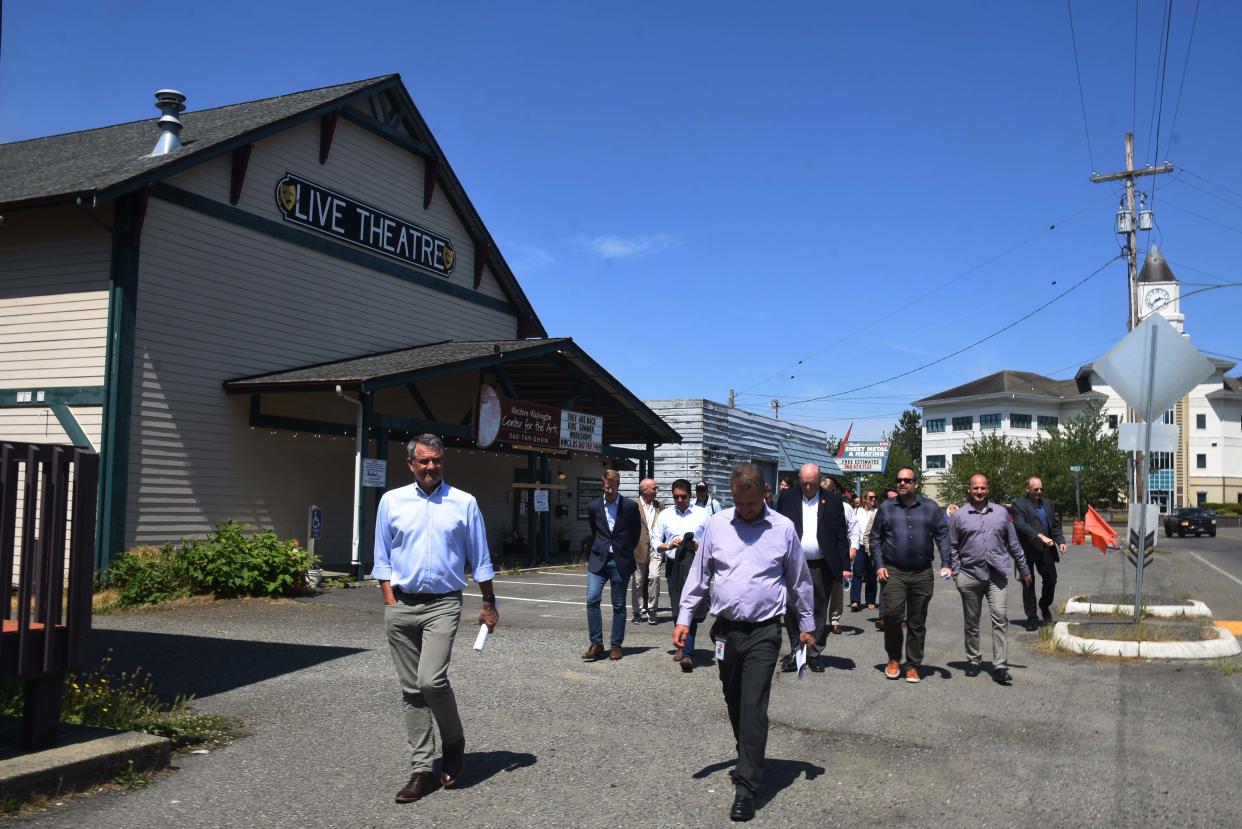 City Officials, EPA representatives and community leaders tour a brownfield site in downtown Port Orchard on June 26.
