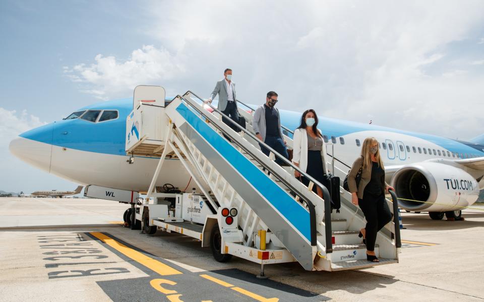 Passengers alighting TUI's first flight after lockdown