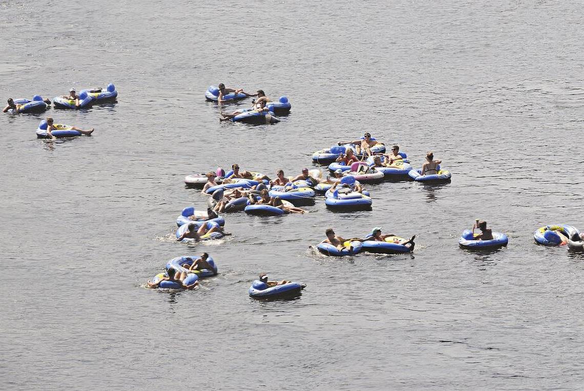 Dozens of tubers float down the Catawba River.