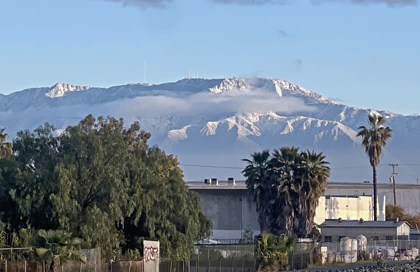 After a cold front passed, the snow-capped San Gabriel Mountains can be seen, with Mount Wilson at center, from Whittier Blvd. at the San Gabriel River, in Pico Rivera on Sunday morning, Feb. 26, 2023.