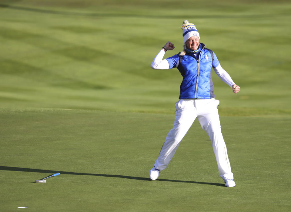 Suzann Pettersen of Europe celebrates after holing a putt on the 18th green to win the Solheim cup against the US at Gleneagles, Auchterarder, Scotland, Sunday, Sept. 15, 2019. (AP Photo/Peter Morrison)