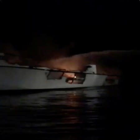 Social media video grab of water being sprayed on the Conception commercial diving vessel after a fire broke out, near Santa Cruz Island