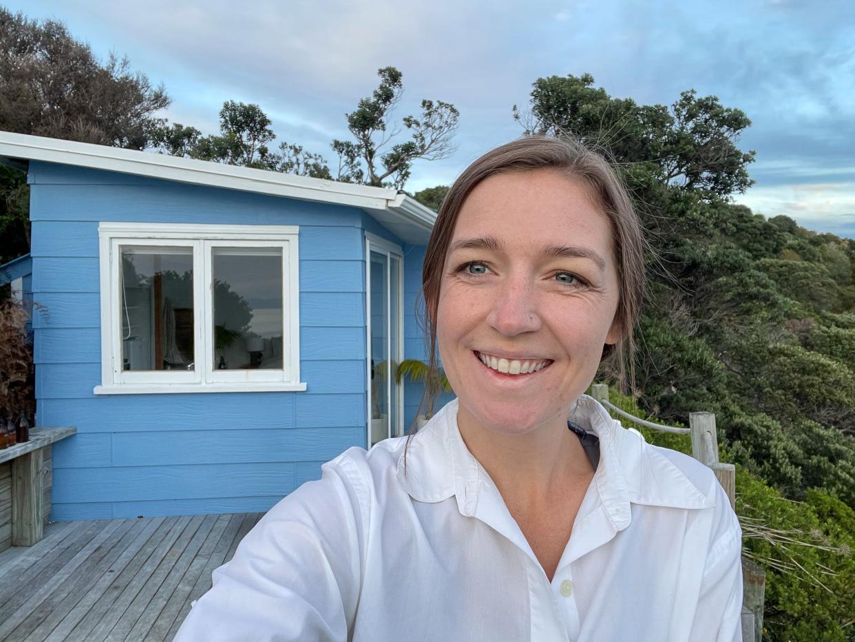 The author in front of the tiny house on New Zealand's Waiheke Island.