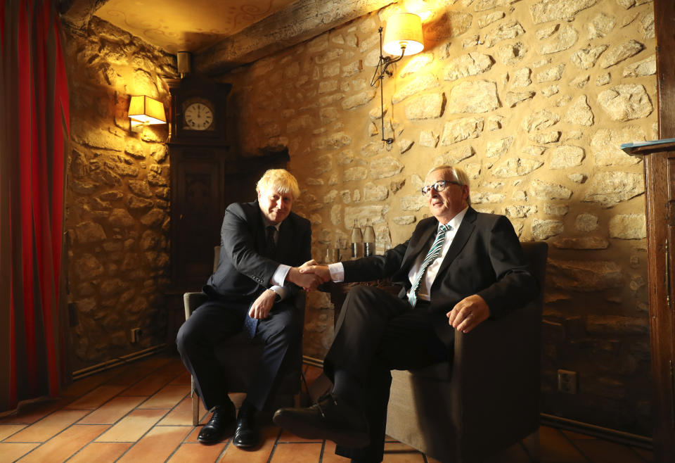 European Commission President Jean-Claude Juncker, right, shakes hands with British Prime Minister Boris Johnson prior to a meeting at a restaurant in Luxembourg, Monday, Sept. 16, 2019. British Prime Minister Boris Johnson was holding his first meeting with European Commission President Jean-Claude Juncker on Monday in search of a longshot Brexit deal. (AP Photo/Francisco Seco, Pool)