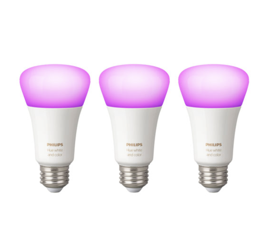 three Philips Hue A19 Smart Bluetooth LED Light Bulbs in white and pink bulbs