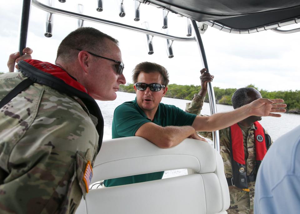 Col. James Booth (left), of the Jacksonville District, takes a tour of the St. Lucie River's South Fork with Stuart Mayor Merritt Matheson (center) on Thursday, June 9, 2022, in Martin County. "The main reason for this is to get the Army Corps out on the water," said Matheson. "Showing someone physically what they are trying to fix, what they're striving to keep, improve or showing them the problems that have occurred has a real impact."