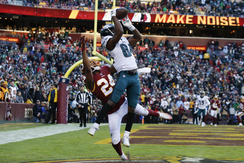 Philadelphia Eagles wide receiver Greg Ward (84) catches a touchdown pass beating out Washington Redskins cornerback Josh Norman (24) in the second half of an NFL football game, Sunday, Dec. 15, 2019, in Landover, Md. Eagles won 37-27. (AP Photo/Alex Brandon)