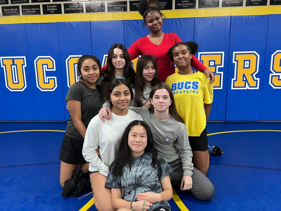 Laney girls wrestlers pose ahead of Tuesday's practice