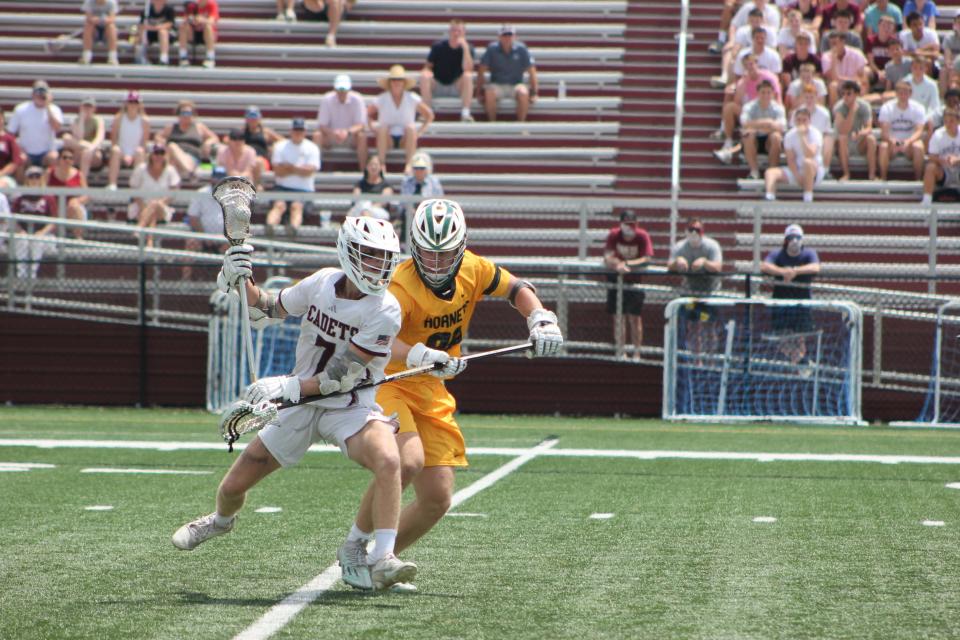 Benedictine's Calvin Rose (No. 7) looking for an opening against a Savannah Country Day defender in BC's win on April 20, 2024.