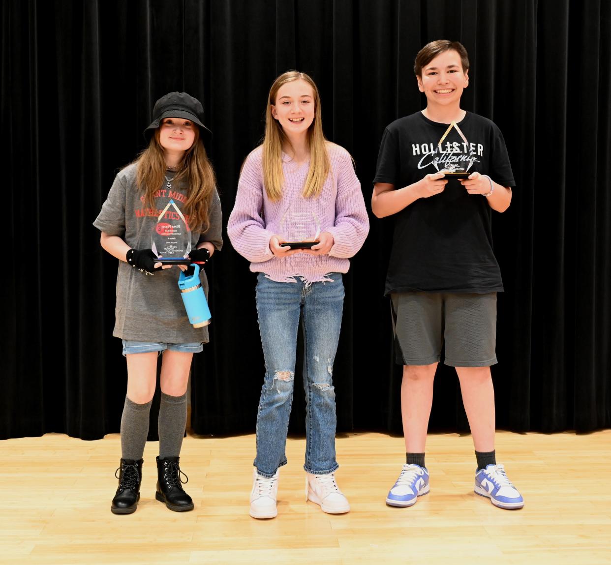 Taking top honors among sixth graders in the annual Math Challenge was Delia Messaros (left) from Grant Middle School. Mira Taylor from North Union Middle School (center) finished second while Chayton Stiles from Elgin Middle School was third.