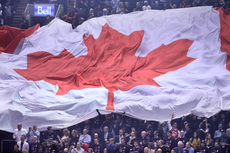 TORONTO, ON- MAY 30  - The Canadian flag rolls across the lower bowl  as the Toronto Raptors beat the Golden State Warriors in game One of the NBA Finals  in Toronto. May 30, 2019.        (Steve Russell/Toronto Star via Getty Images)