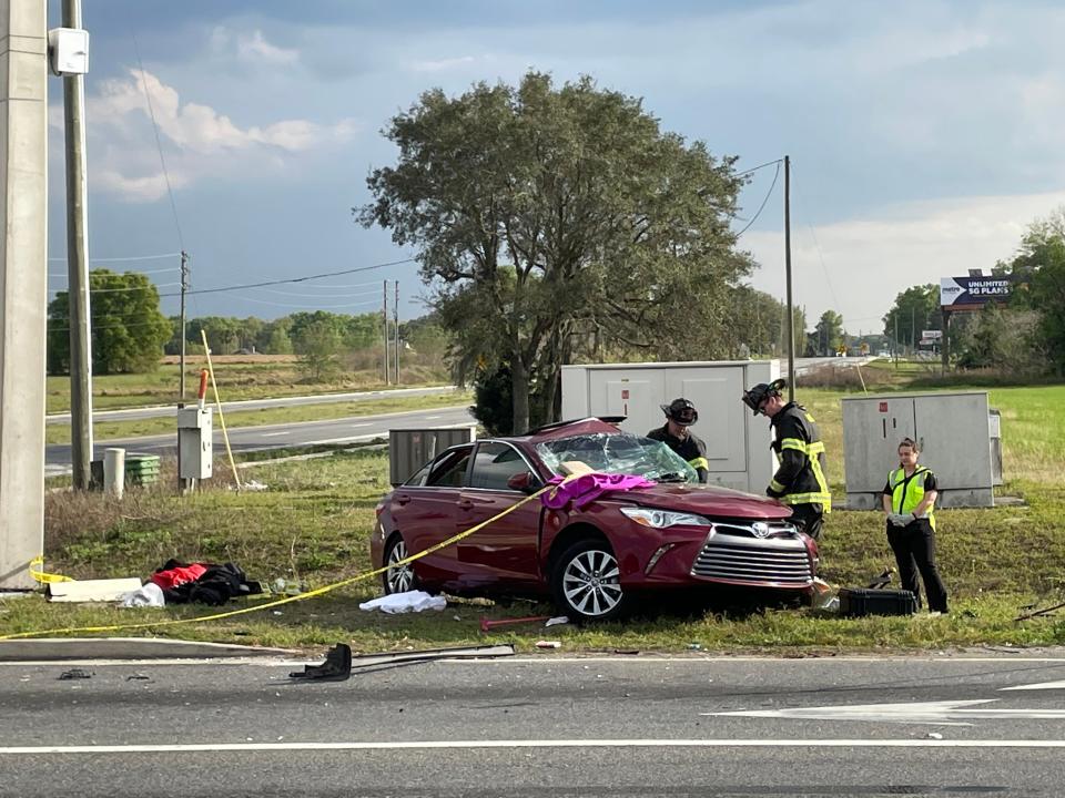 Fire rescue officials work to extricate the driver of this Toyota Camry following a two-vehicle crash in March. The driver, Carole Lanzer, died in the crash.