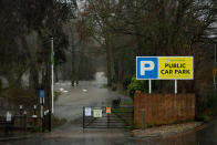 Flood water covers a car park after the River Severn burst its banks in Worcester following heavy rain.