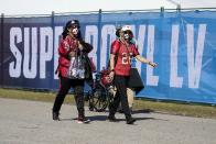 Fans arrive at Raymond James Stadium before the NFL Super Bowl 55 football game between the Kansas City Chiefs and Tampa Bay Buccaneers, Sunday, Feb. 7, 2021, in Tampa, Fla. (AP Photo/Lynne Sladky)