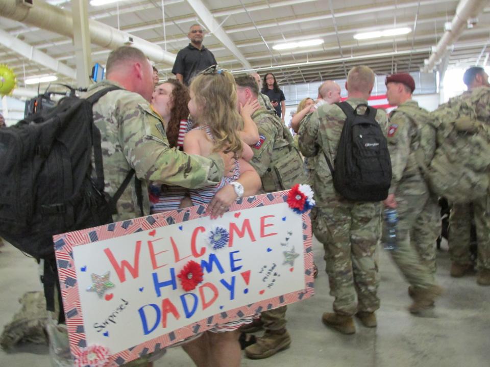 Partroopers in the 82nd Airborne Division and their families reunite Tuesday, June 28, 2022, at Fort Bragg's Green Ramp, as the paratroopers returned home from a deployment to Poland.