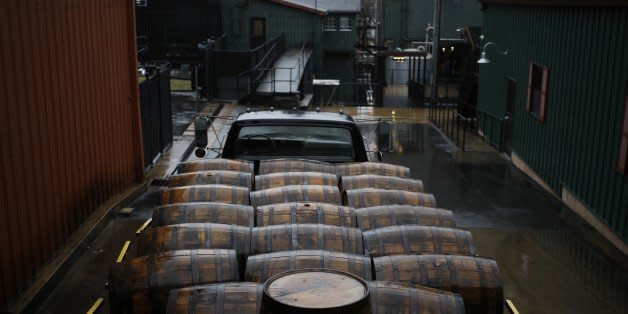 CLERMONT, KY - JANUARY 13:  Barrels of Knob Creek Single Barrel Bourbon sit on a flatbed truck after being drained at the Jim Beam Bourbon Distillery on January 13, 2014 in Clermont, Kentucky. Japanese company Suntory Holdings acquired Beam Inc. for $13.6 Billion in a deal announced Monday. Beam is the owner of Jim Beam and Maker's Mark bourbon brands and was purchased at $83.50 per share. (Photo by Luke Sharrett/Getty Images)