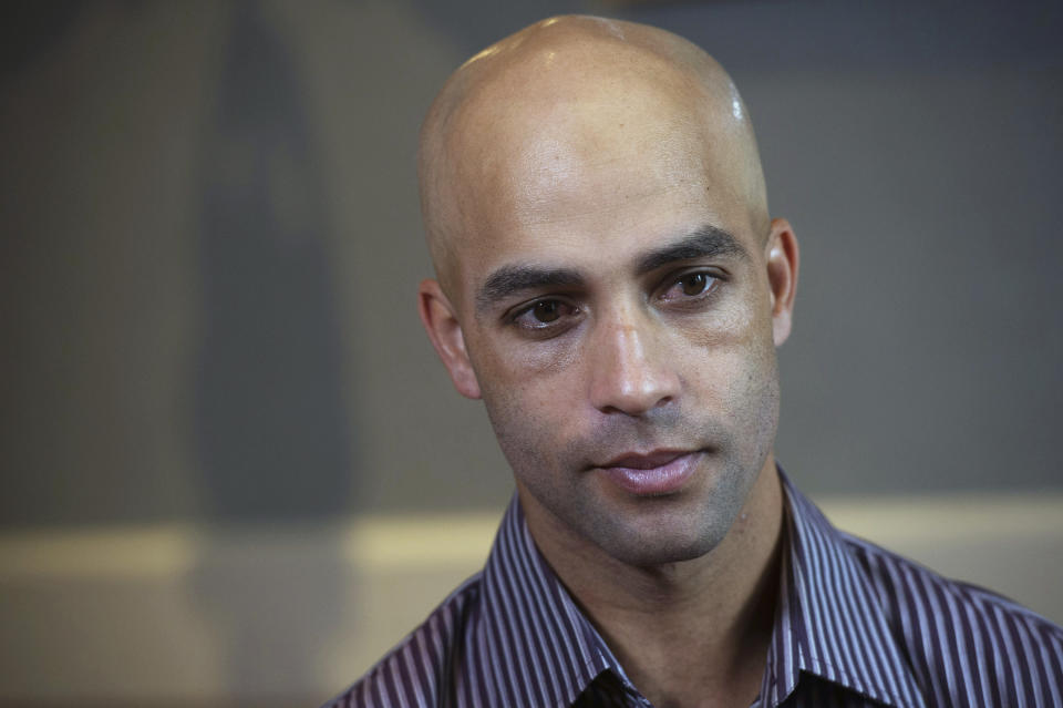 FILE - This is a Sept. 12, 2015, file photo showing former tennis star James Blake discussing his mistaken arrest by the New York City Police Department during an interview in New York. Nearly five years later, Blake says he never suspected the large man running toward him was a plainclothes New York City policeman. But Blake, who is black, had been mistakenly identified as a suspect in a credit card fraud scheme. Video captured the undercover officer grabbing him by the arm, throwing him to the sidewalk face down and handcuffing him. All of which intensified Blake's reaction to video of George Floyd's death shortly after being detained by Minneapolis police last week. (AP Photo/Bryan R. Smith, File)
