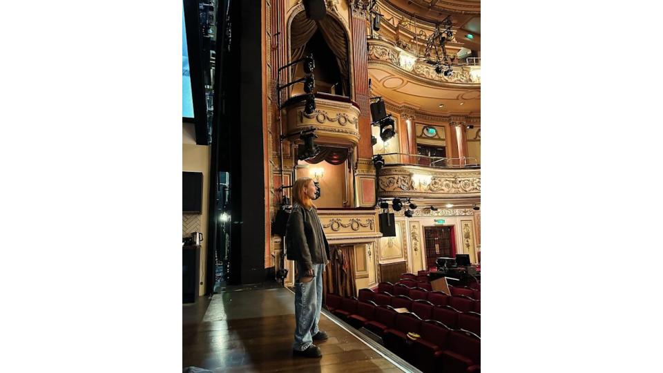 Stacey Dooley standing on stage