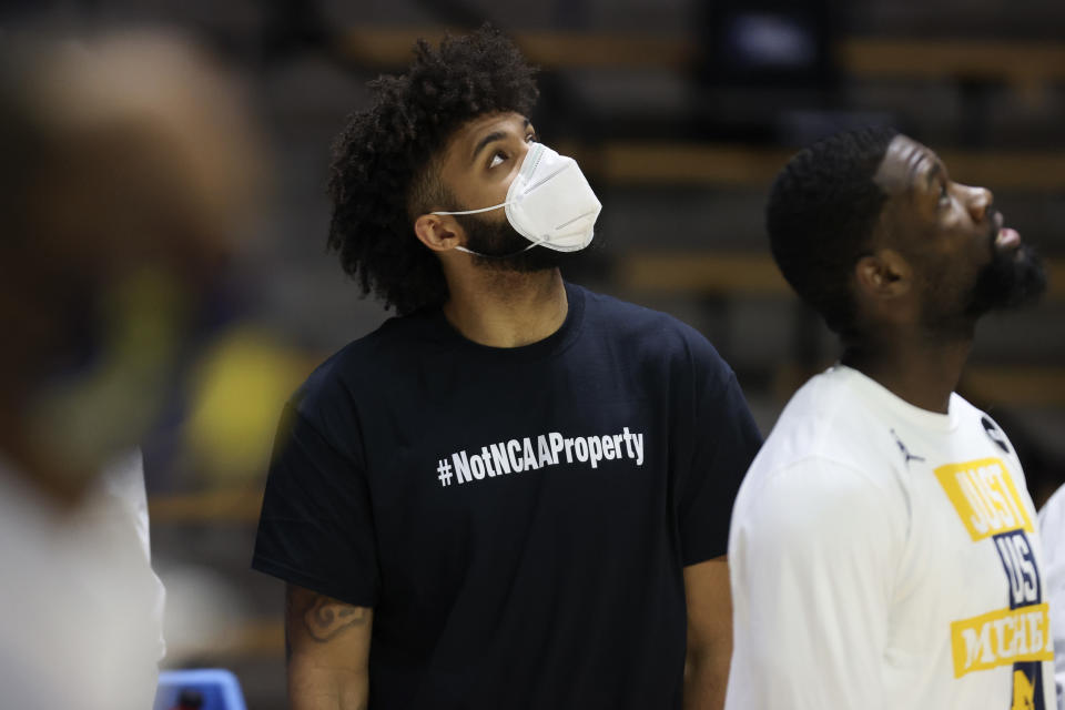 WEST LAFAYETTE, INDIANA - MARCH 20: In a t-shirt and walking boot, Isaiah Livers #2 of the Michigan Wolverines looks on prior to the game against the Texas Southern Tigers in the first round game of the 2021 NCAA Men&#39;s Basketball Tournament at Mackey Arena on March 20, 2021 in West Lafayette, Indiana. (Photo by Gregory Shamus/Getty Images)