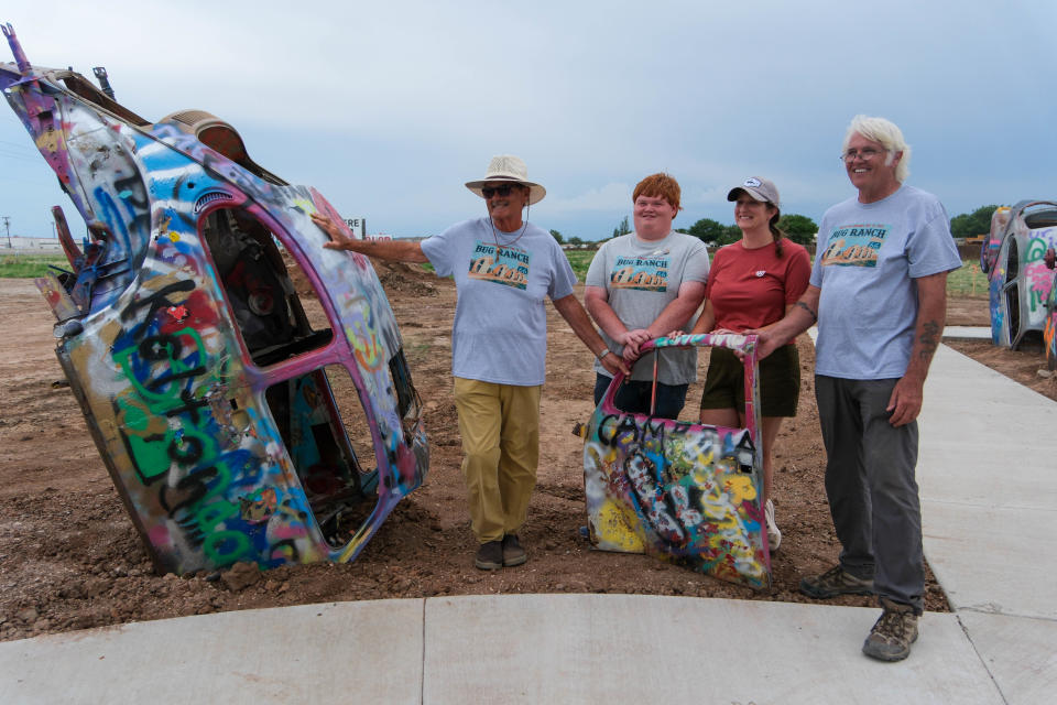 Bobby Lee and other members of the Bug Ranch Association show off the literal door prize Friday at the christening of the new Big Texan Route 66 Bug Ranch in Amarillo.