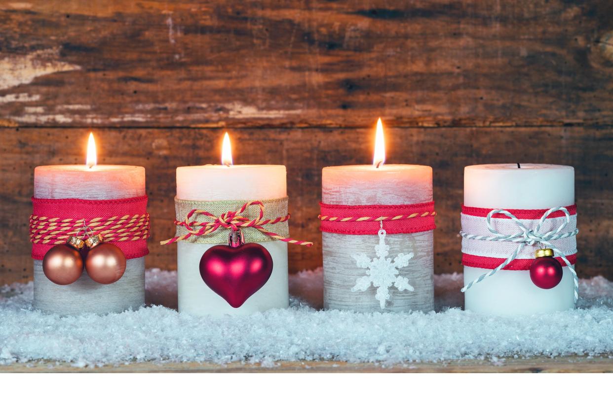 Decorative Christmas candles with a wooden background